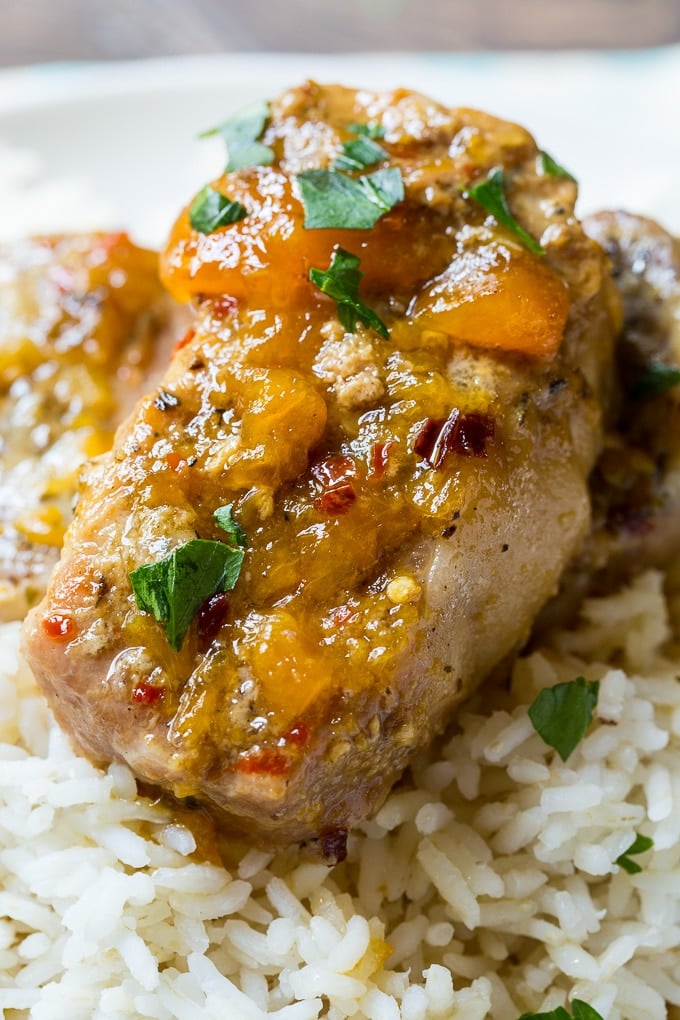 Pork chops with spicy peach glaze cooked in the crockpot.