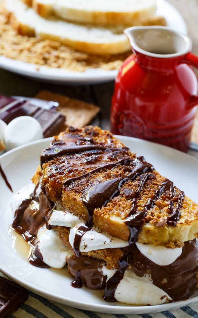 S'mores French Toast- coated in crushed graham crackers and stuffed with marshmallows and Hershey chocolate.