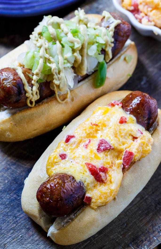 Grilled Brats topped with Pimento Cheese and Green Tomato Chow Chow