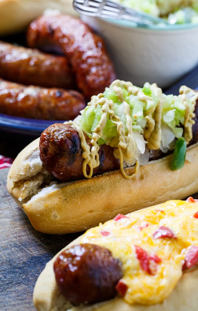 Grilled Brats topped with Pimento Cheese and Green Tomato Chow Chow