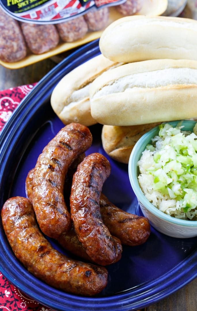 Grilled Brats topped with Pimento Cheese and Green Tomato Chow Chow