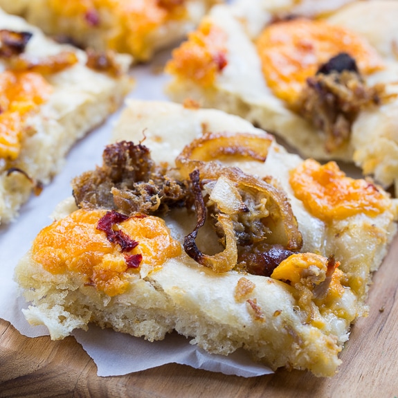 Southern-Style Focaccia with pulled pork, pimento cheese, and vidalia onions.