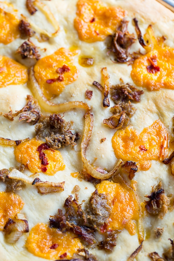 Southern-Style Focaccia with pulled pork, pimento cheese, and vidalia onion.