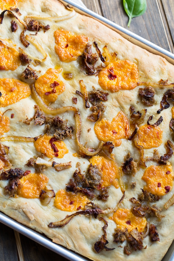 Southern-Style Focaccia with pulled pork, pimento cheese, and vidalia onion.