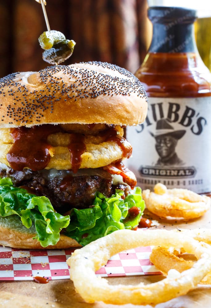 Cowboy Burgers with bacon, bbq sauce, and onion rings.