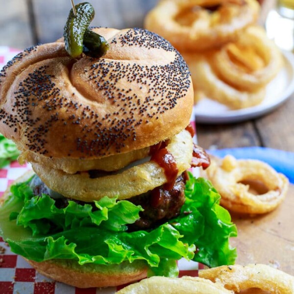 Cowboy BUrgers topped with bacon, onion rings, and bbq sauce.