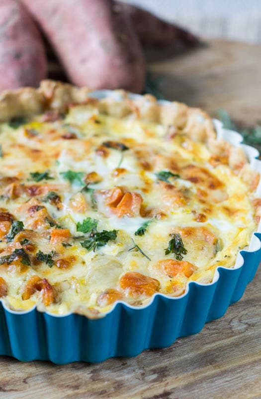 Sweet Potato Quiche in a blue tart pan.