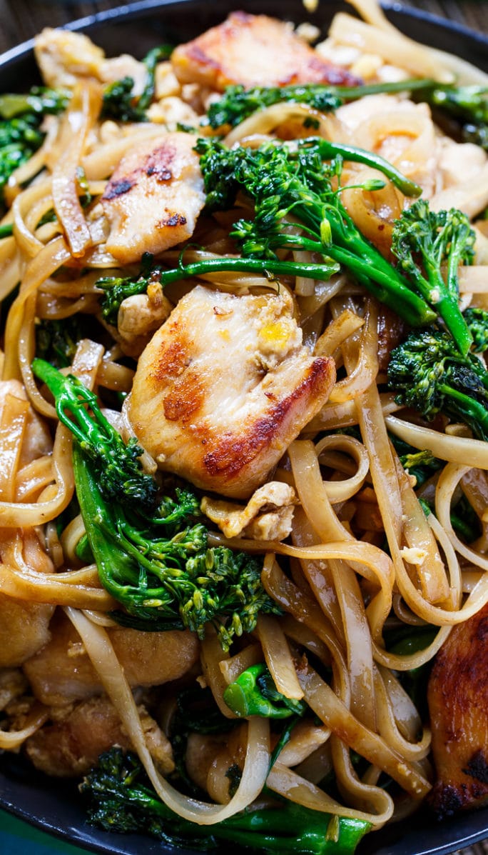 Close-up of Thai Stir-Fried Noodles with Chicken and Broccolini.