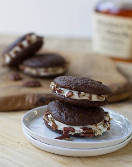 Two Whoopie Pies stacked on a small white plate.
